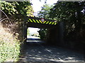 Low railway bridge over the B5282, Arnside in LA5 0HP