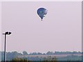 Plane and balloon over Wanborough in SN3 0AQ