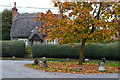 Thatched cottage and autumn leaves by the church at Wilcot in SN9 5PJ