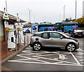 Recharging an electric car at Reading Services in RG30 3RA