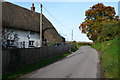 Thatched cottage beside lane at Ablington in SP4 8JX