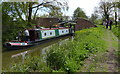 Narrowboat passing under bridge no 49 in CV35 8PP