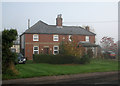 Red-brick cottages on the edge of Bourn in CB23 2TX