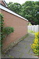 Footpath running past the garage of #122 Lowry Hill in CA3 0ER