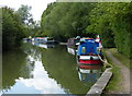 Narrowboats moored along the Grand Union Canal in MK9 3FY