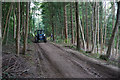 Tractor transporting logs in GL3 4SJ