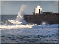 Waves breaking over the harbour wall, Portreath in TR16 4LF