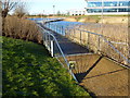 Walkway over lake at Cambridge Research Park in CB25 9PD