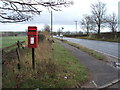 Post box and bus stop on the A689 in Windlestone