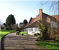Public footpath past barn conversions at Holverston Hall in Holverston