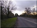 Setting sun and the A38 west of Adsborough in TA2 8RW