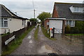 A narrow private, potholed road in TN29 0AP