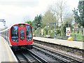 Metropolitan line train leaving Ickenham tube station in UB10 8RU