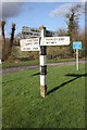 Signpost at crossroads beside B4022 at Delly Hill in OX29 9XG