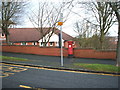 Bus stop and Elizabeth II postbox on Sea Cliff Road, Scarborough in YO11 3AA