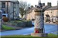 War memorial and houses in Aysgarth in DL8 3TJ