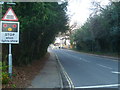 Rusper Road looking south towards station and level crossing in RH12 5TW