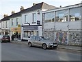 Shops and mosaic panel in Fore Street, Saltash in PL12 6JL