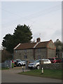 Geese over Salthouse in Salthouse