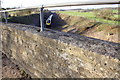 Passenger train viewed over A4095 bridge parapet in OX29 8FD