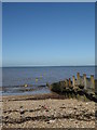 Groyne and buoys on the beach at Whitstable in CT5 2AQ