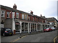 Shops with verandah on Acacia Grove, West Kirby in CH48 0RT