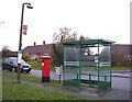 Elizabeth II postbox and bus stop  on Cherry Hinton Road, Teversham in CB5 8TG