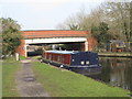 Canal boat moored by Bridge 180, Grand Union Canal in UB9 5EZ