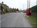 Postbox and telephone box on Denby Lane, Upper Denby in HD8 8UP