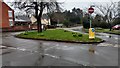 Road junction and traffic island in LE16 8EE