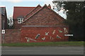 Decorated (Millennium?) wall, Lincoln Road, Bassingham in Bassingham
