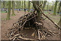 View of a children's den made of sticks in Chalet Wood in E11 2LT