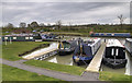 Moored Narrowboats and Footbridge, Barby Moorings in CV23 8UJ