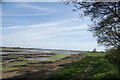 View of Thorney Island across Mill Rithe from the coastal path in PO11 0QW