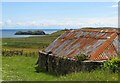 Red roof on a blackhouse in HS2 0QF
