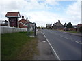 Bus stop and shelter on Main Road (A149), Rollesby in NR29 4TY