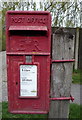 Close up, Elizabeth II postbox on Station Road, Ormesby St Margaret in NR29 3QE