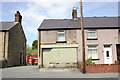 Boarded-up shop, Main Road, Ffynnongroyw in CH8 9UU