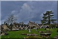 Duntisbourne Abbots: Cottages from the path to the church in GL7 7JN