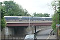 View of a Chiltern Railways train crossing the bridge over Rectory Road in WD3 1QP