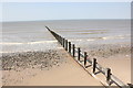 Groyne and beach near Ffrith in LL19 7BH