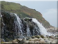 Osmington Mills: a waterfall and the cliffs of Bran Point in DT3 6HQ