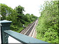 Railway goes north from bridge by Burgess Hill station in RH15 0DQ