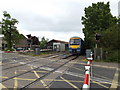 Train approaching Elmswell Level Crossing in IP30 9EX