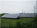 Solar array and wind turbines near The Laurels Farm in PE34 4HZ