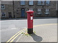 King George V pillarbox and shadow, St Clare Street, Penzance in TR18 2RL