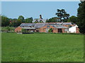 Buildings at Home Farm in LL11 3BP