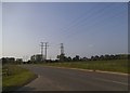 Fields and electricity poles on Amners Farm Road in RG30 3UL