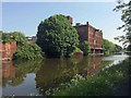 Former bakery reflected in the Sheffield and South Yorkshire Navigation in S64 9AL