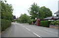 Bus stop and telephone box on Main Road, Goostrey in CW4 8PN